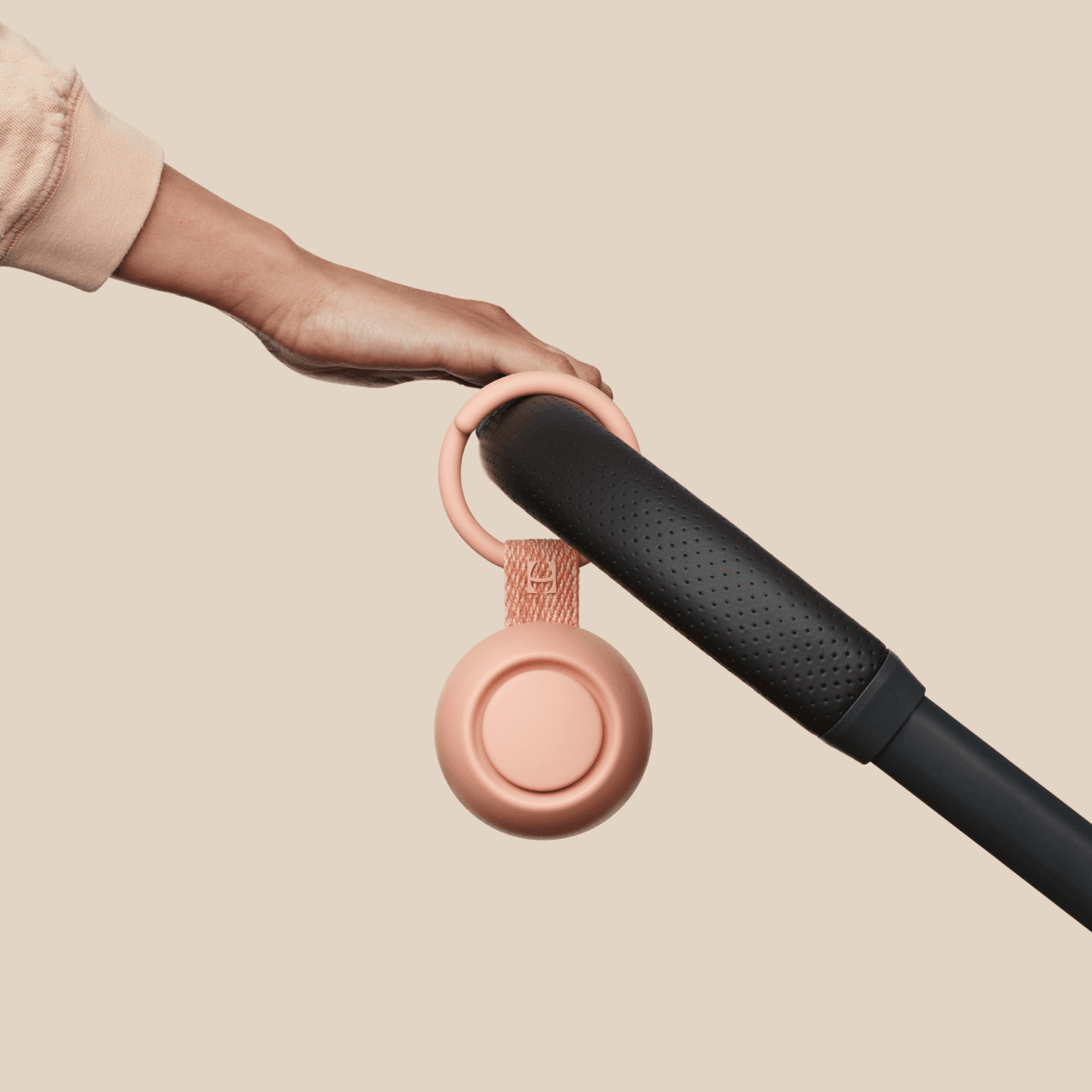 Hatch peach  rest go clipped to baby stroller