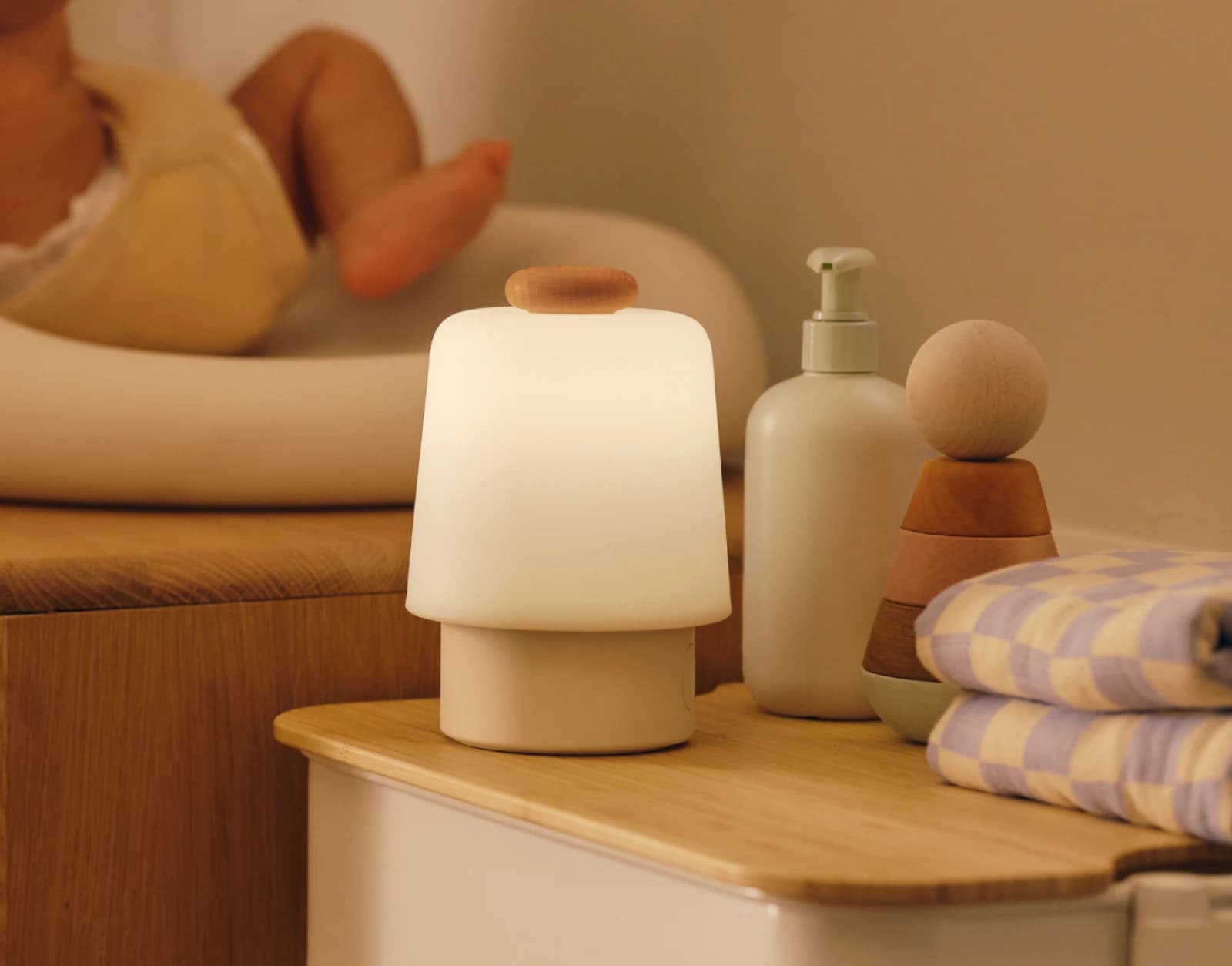 Hatch Baby Beechwood sitting on a nursery changing table