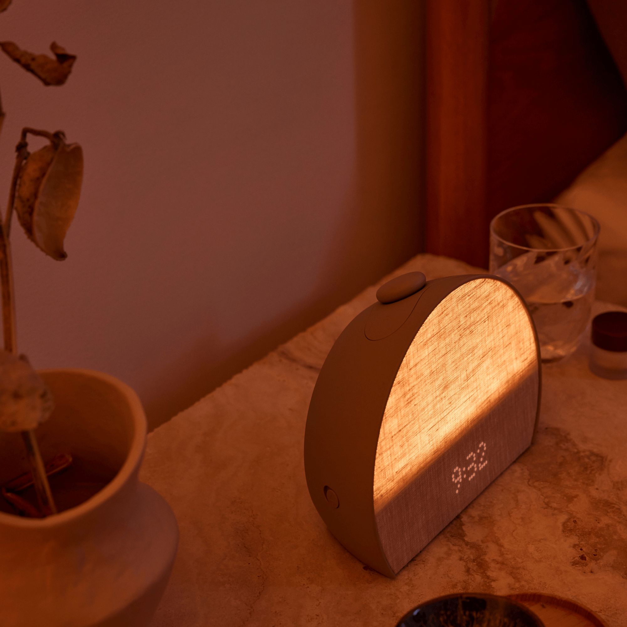 Restore 3 lit up on a bedside table