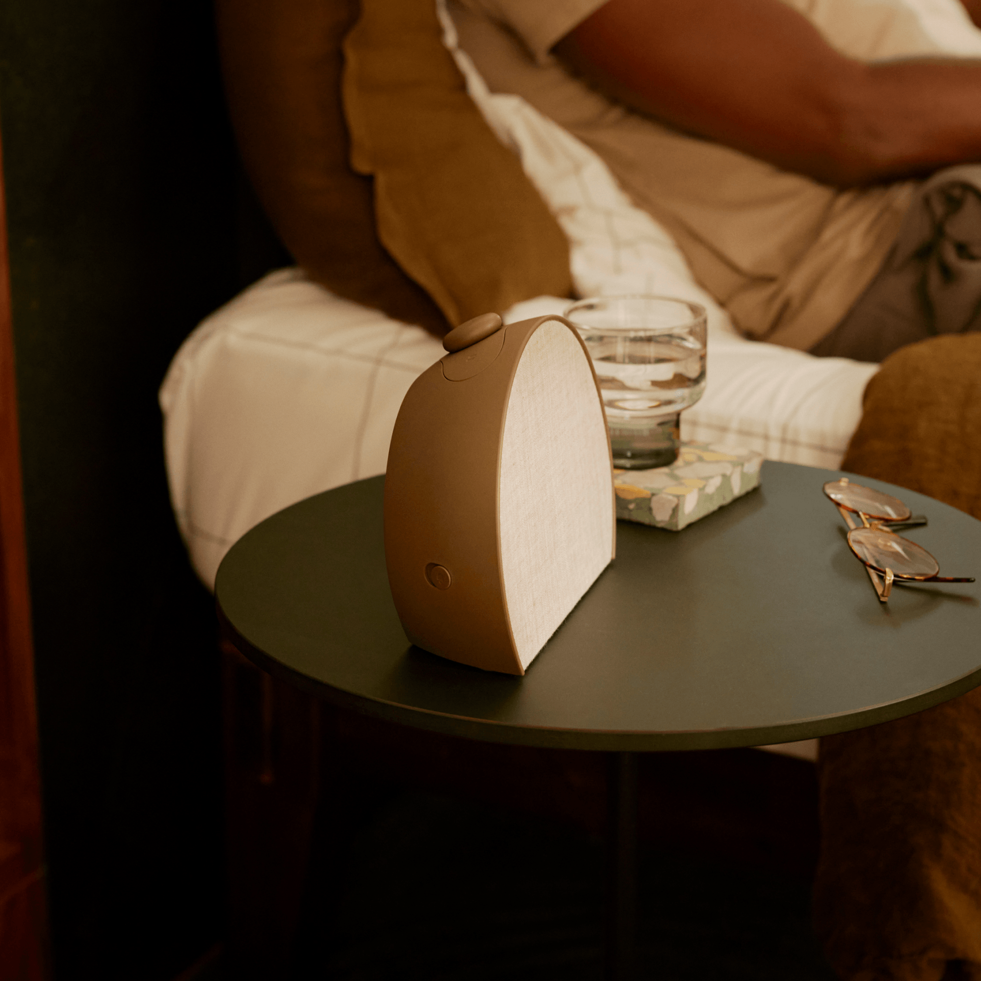 Restore 3 on a bedside table