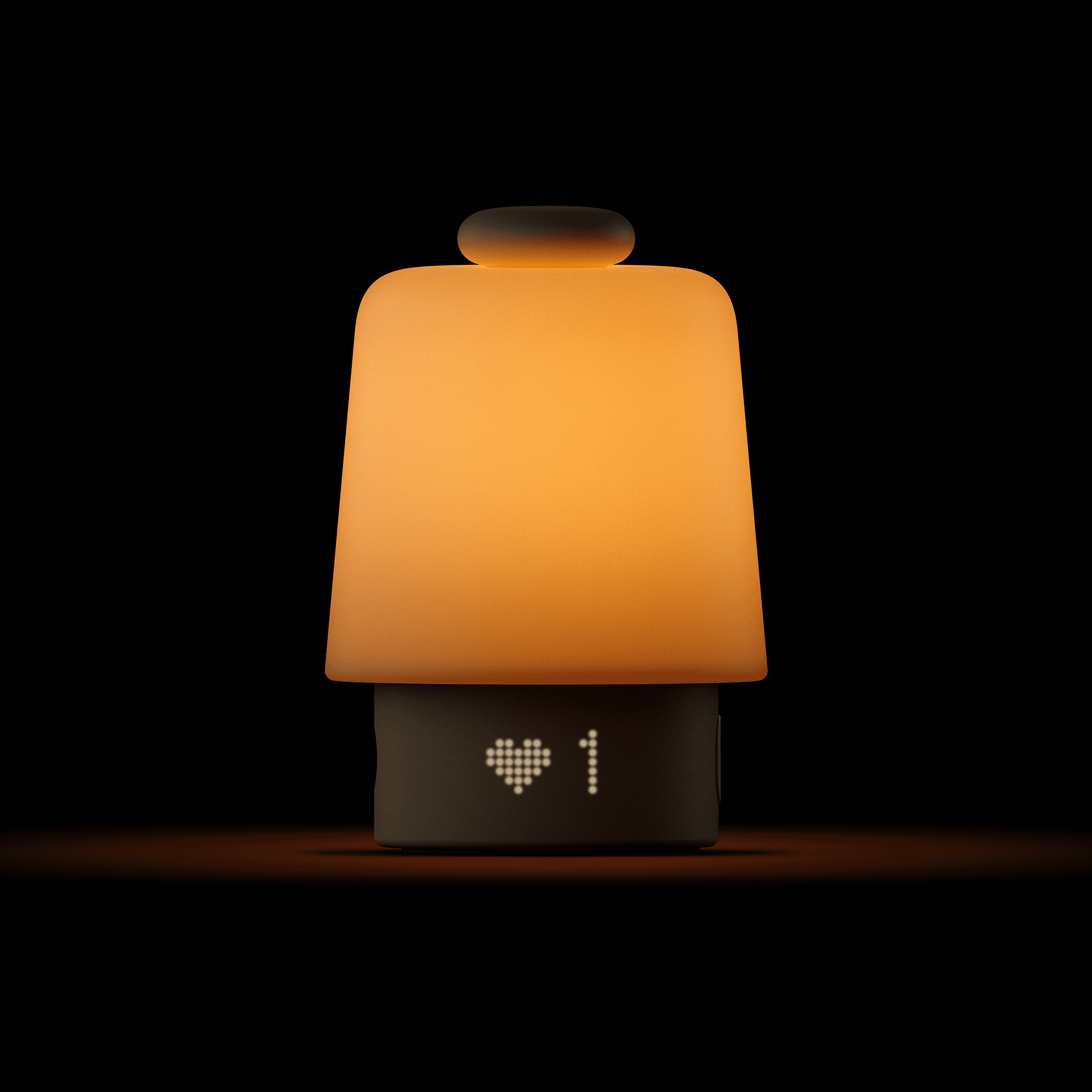 Hatch Baby lit up in the dark with the 1 favorite on the LED display