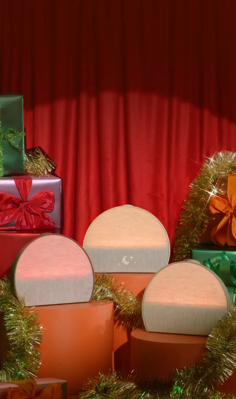 3 Hatch Restore colorways sitting on holiday presents with tinsel wrapped around